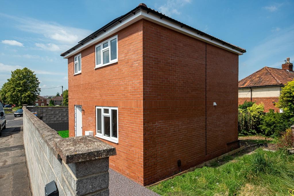 The exterior view of a two-story brick house wi...