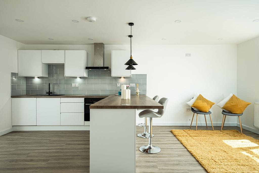 A modern and clean kitchen with a breakfast bar...