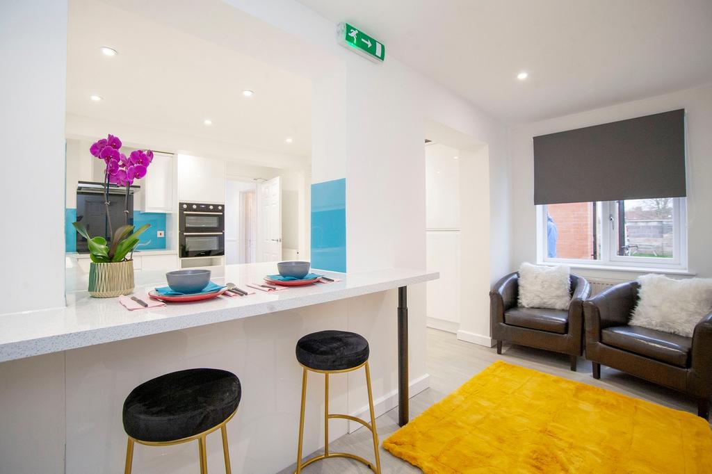 A clean and modern living room with stylish fur...