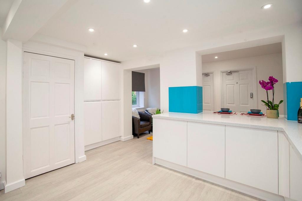 A modern and clean kitchen with bright lighting...