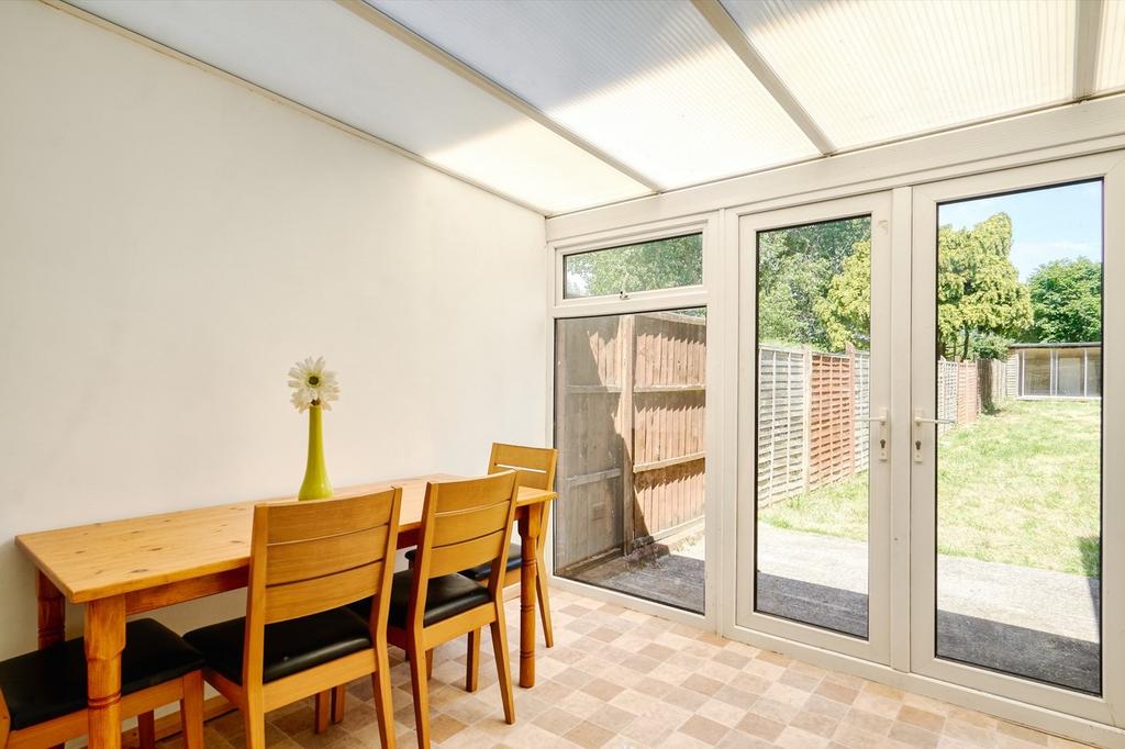 A bright and clean dining area with a view of t...