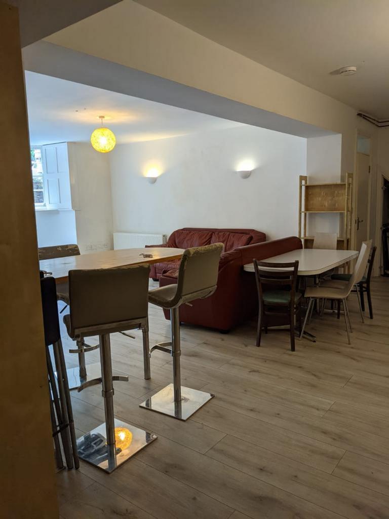 A spacious and well-lit modern living room with...