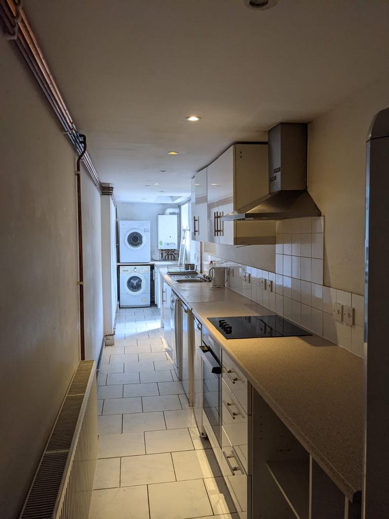 A tidy kitchen with modern appliances, includin...