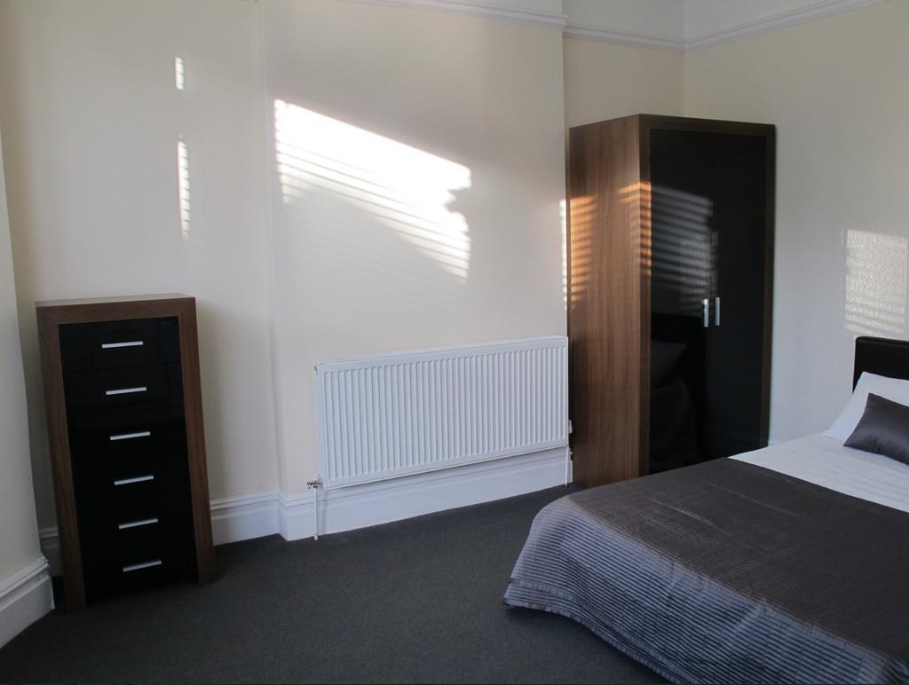 A bright and spacious double bedroom featuring ...