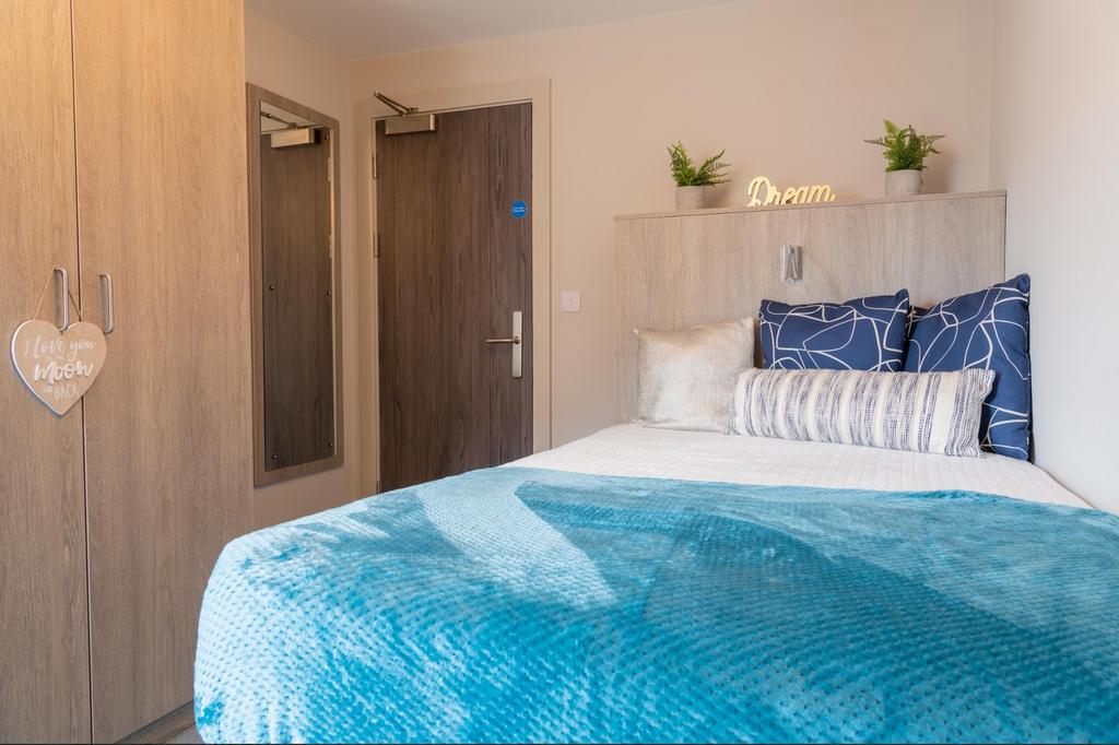 A beautifully styled double bedroom with modern...