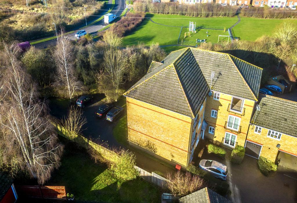 Aerial View Of Apartment With Play Area &amp; Parking