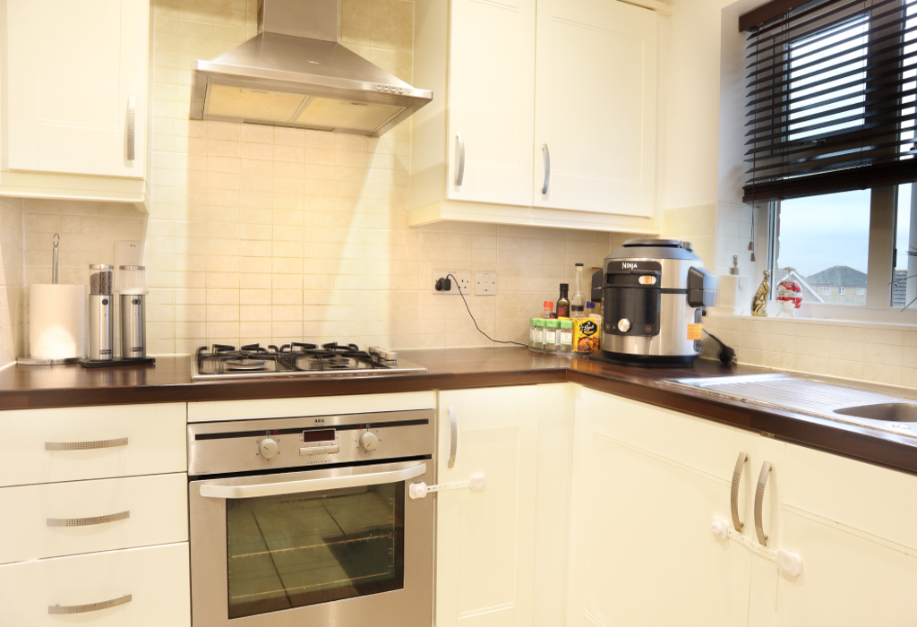 Fully Equipped Kitchen Separate From Living Room