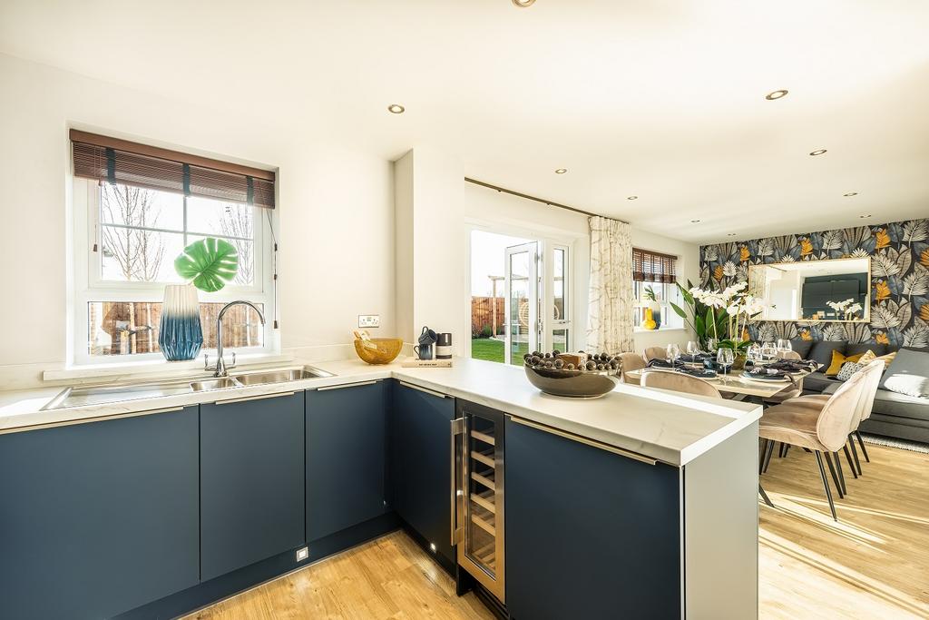 Open plan kitchen with dining space and family...