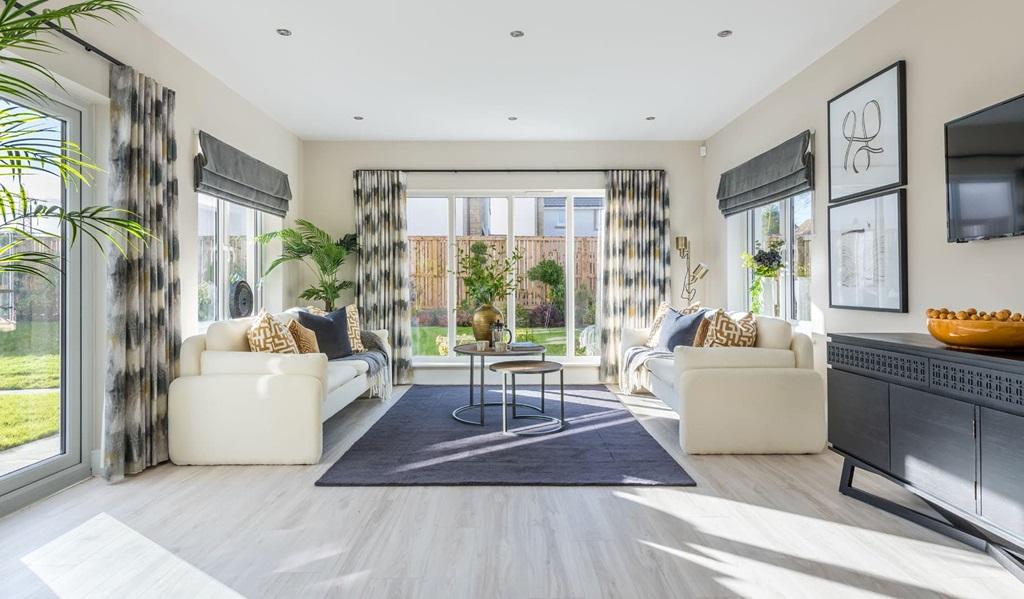 The tranquil garden room with French doors to...