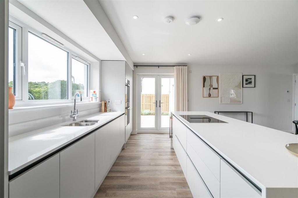 7. Kitchen with access to enclosed rear garden.jpg