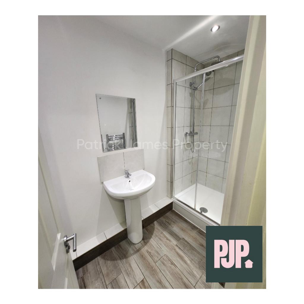 A modern and well maintained bathroom featuring...