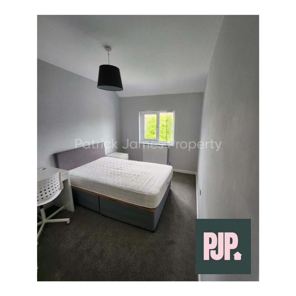 A spacious and well lit double bedroom, perfect...