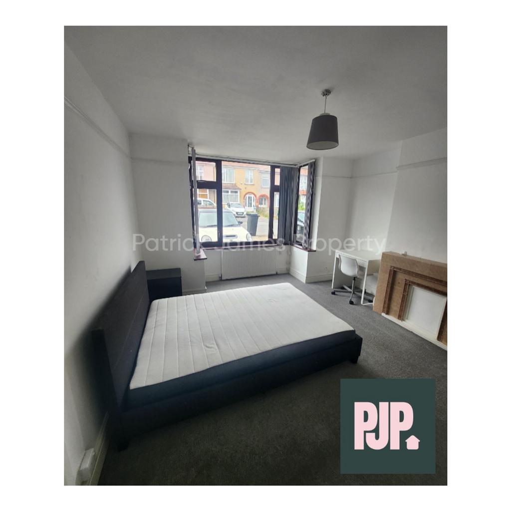 A spacious and bright double bedroom, perfect f...