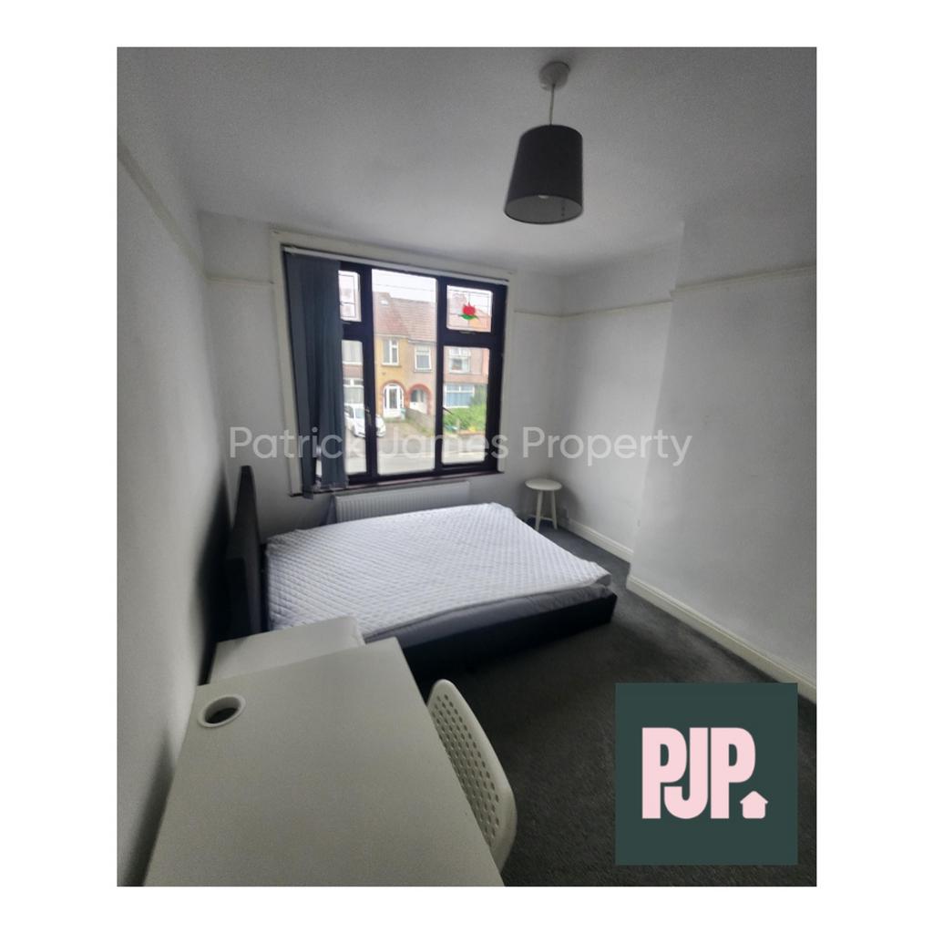 A spacious and bright double bedroom, perfect f...
