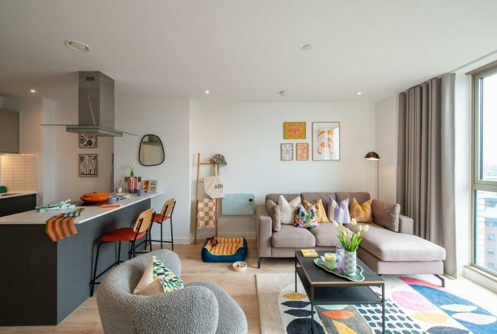 A bright and stylish large modern living room w...