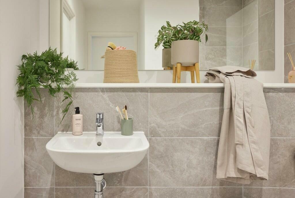 A clean and modern bathroom featuring a stylish...