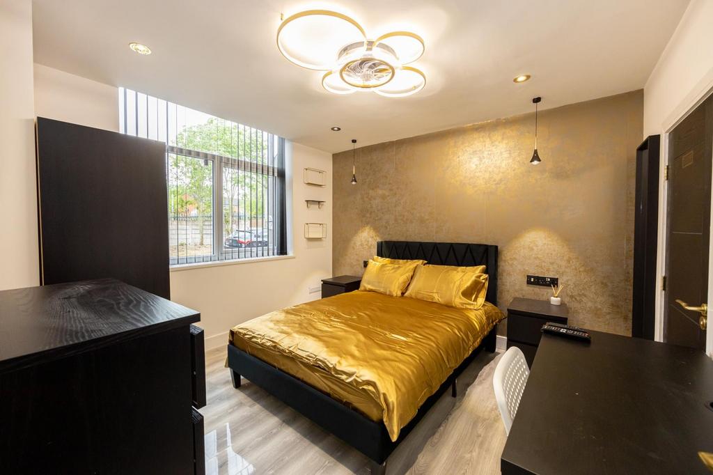 A stylish and spacious large double bedroom fea...