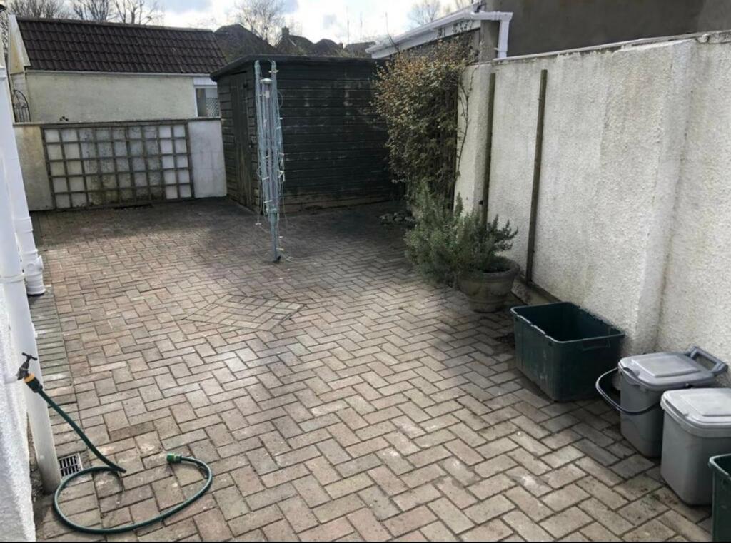 A spacious and tidy garden area, perfect for re...