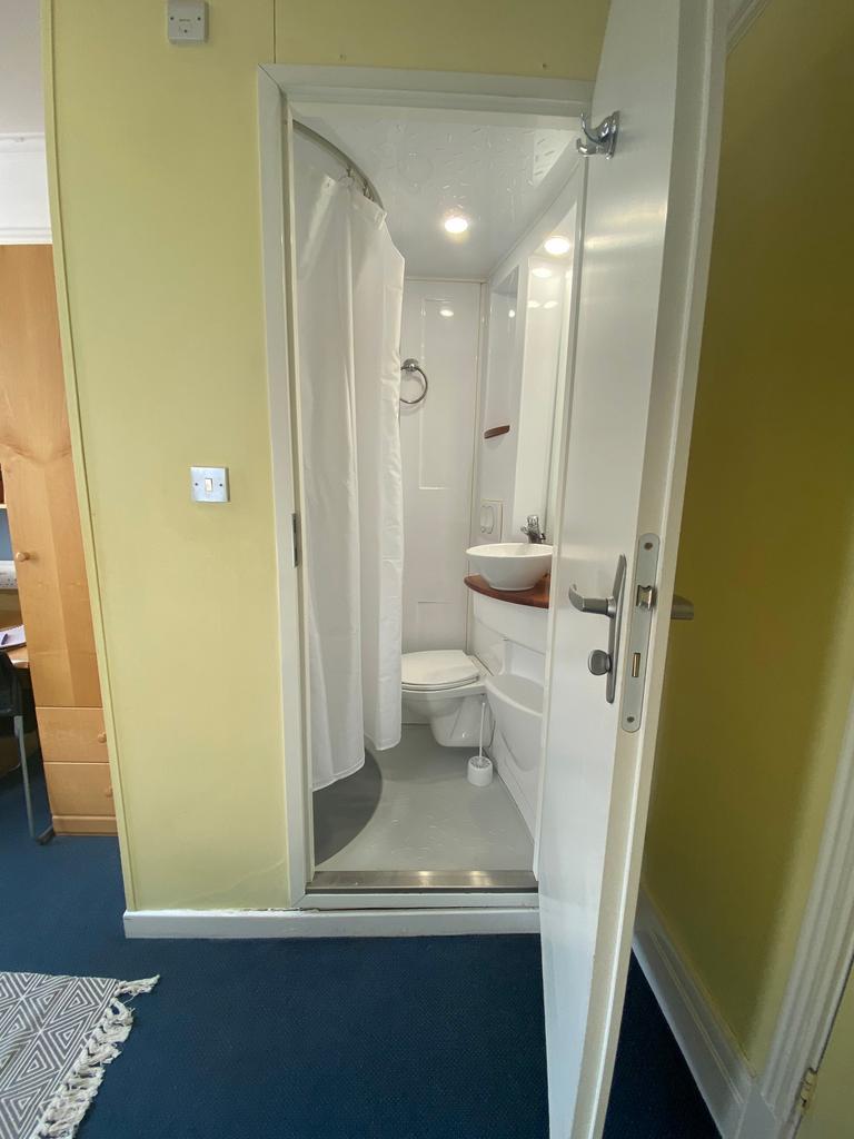 A bright and tidy bathroom featuring modern fix...