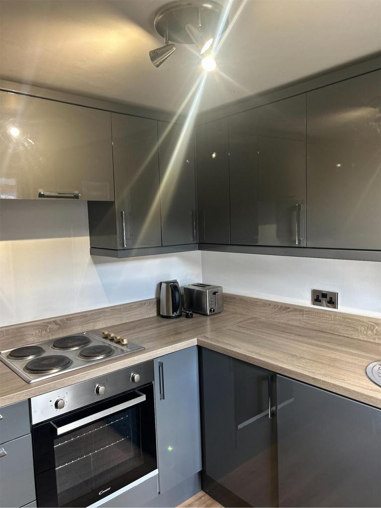 A modern and stylish kitchen with sleek cabinet...