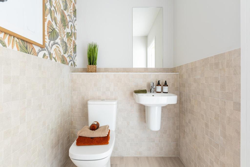 A guest cloakroom completes the ground floor