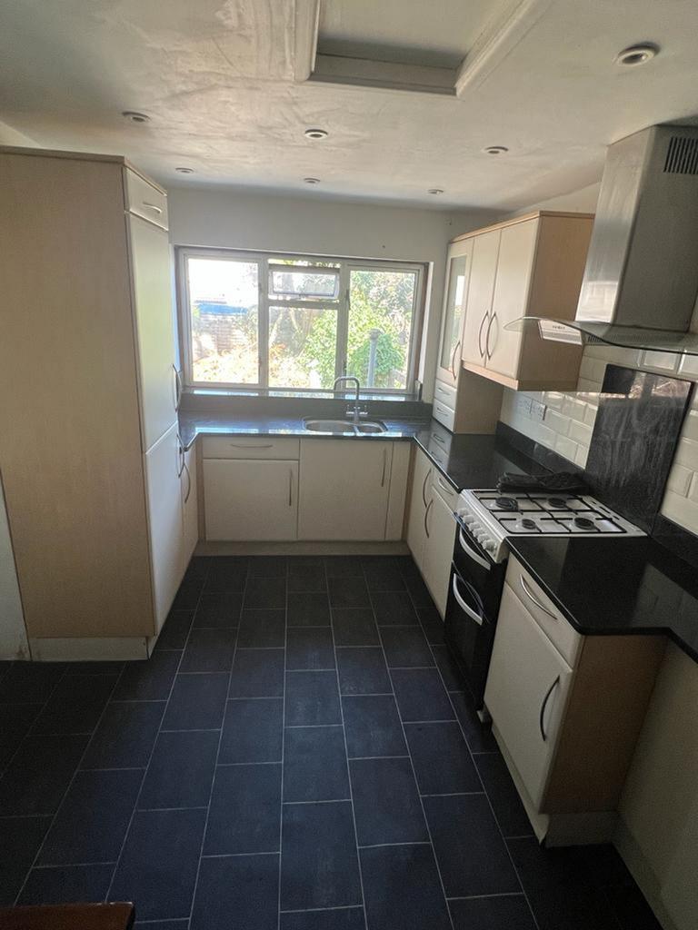 A bright and modern kitchen with ample counter ...