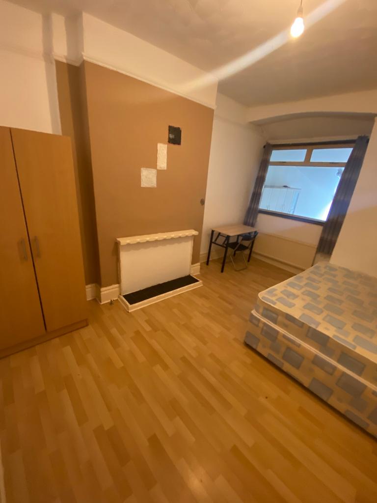 A spacious and inviting double bedroom with amp...