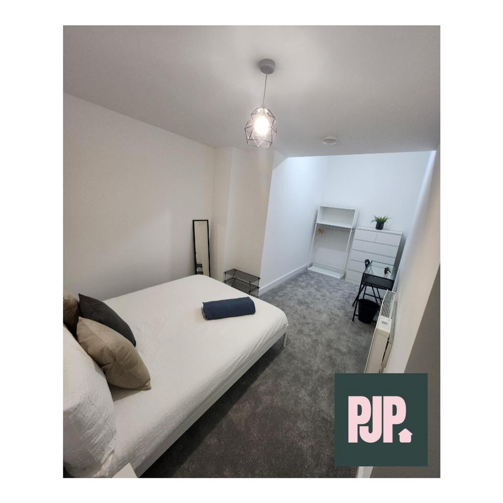 A stylish and inviting double bedroom, perfect ...