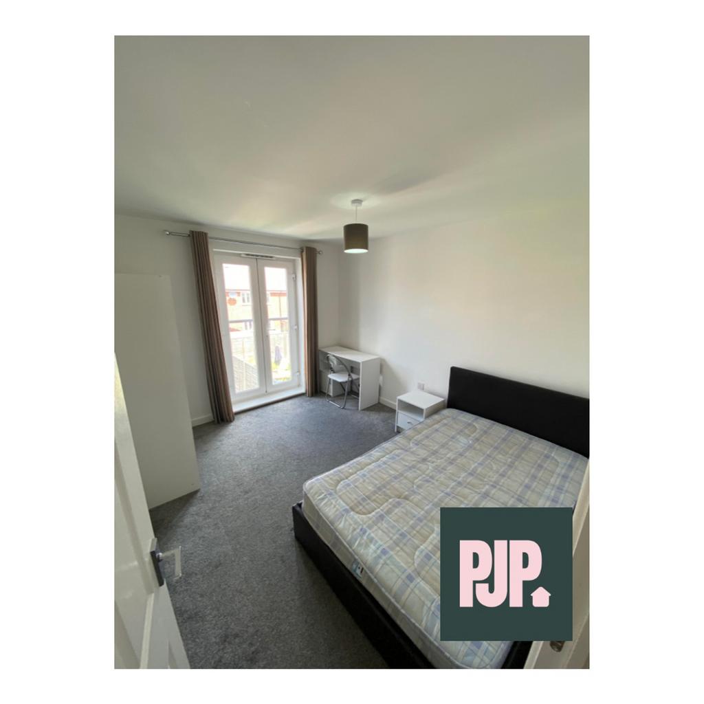 A bright and spacious double bedroom with acces...