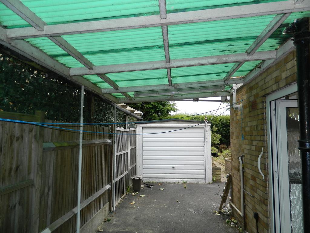 Carport leading to garage