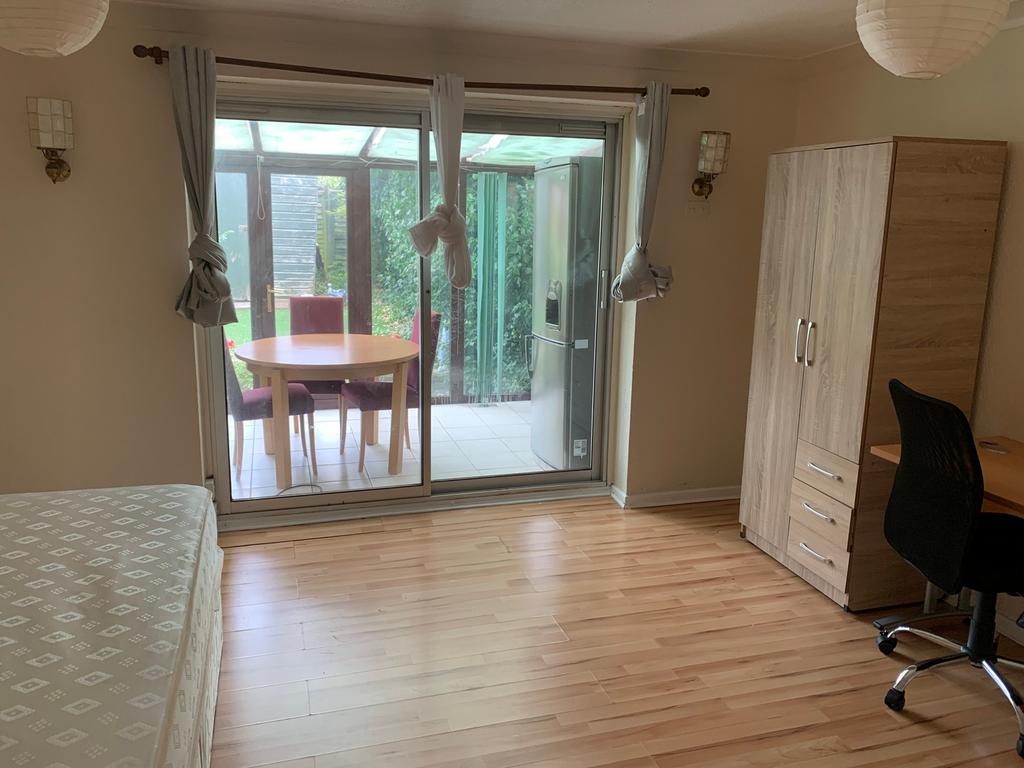 A spacious and bright large double bedroom with...