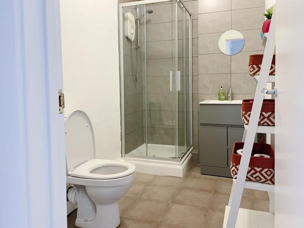 A stylish and clean bathroom featuring a modern...