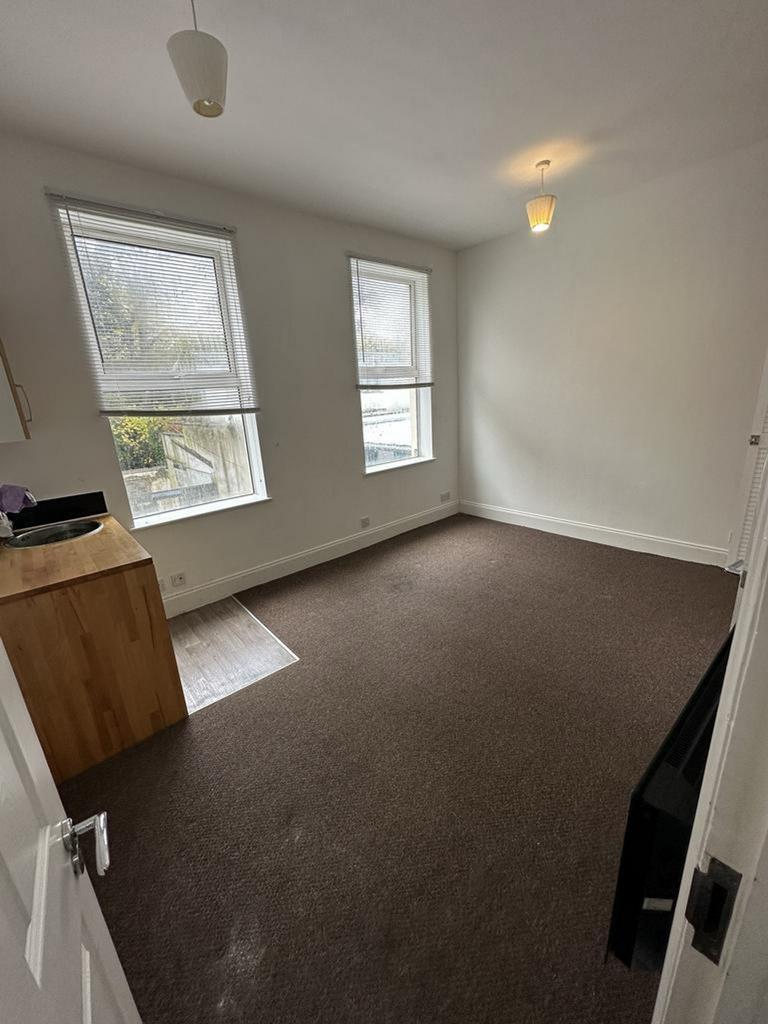 A bright and inviting double bedroom with ample...