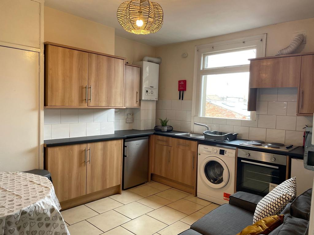 A well-maintained kitchen featuring wooden cabi...