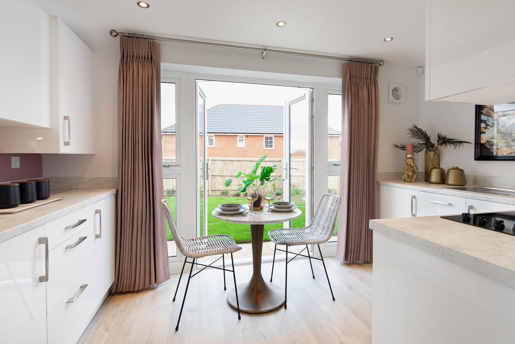 Open plan kitchen with French doors in the...