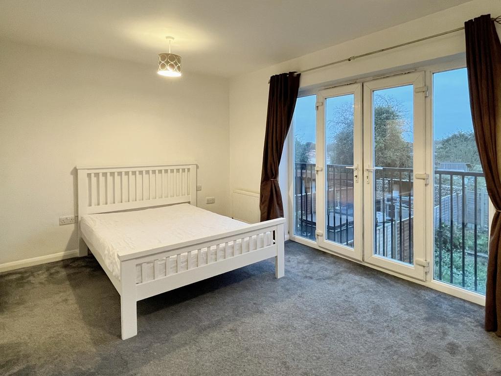 A spacious and bright large double bedroom with...