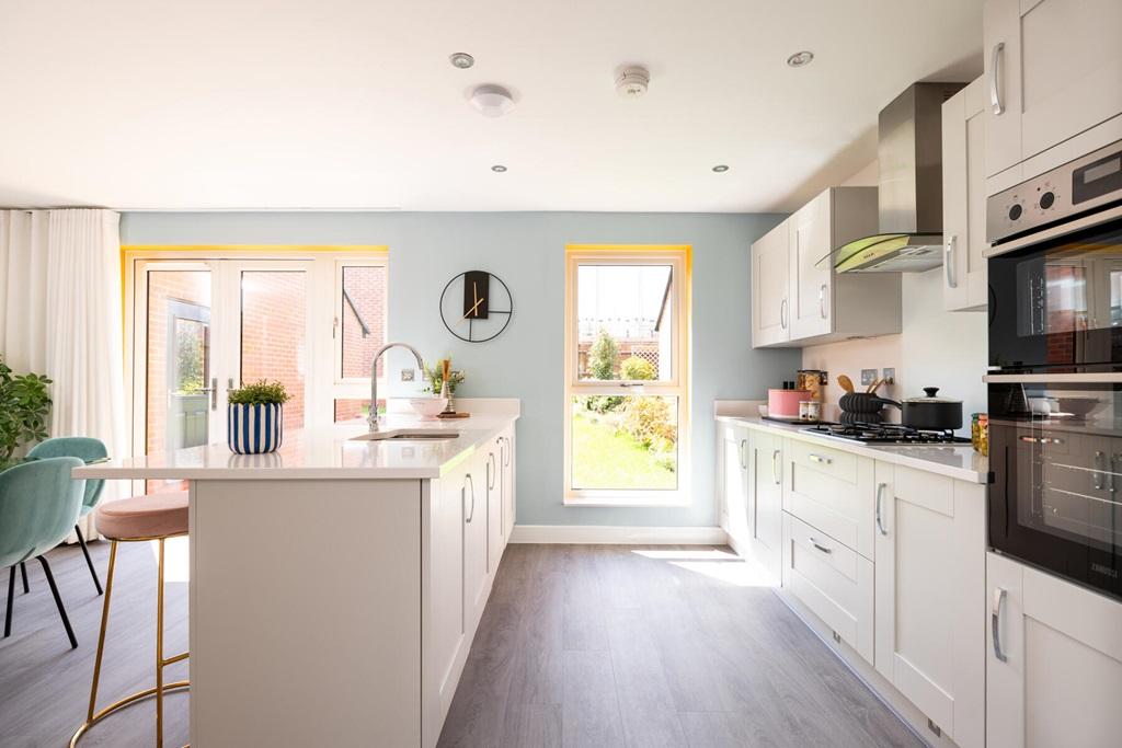 Modern kitchen with ample storage space and...