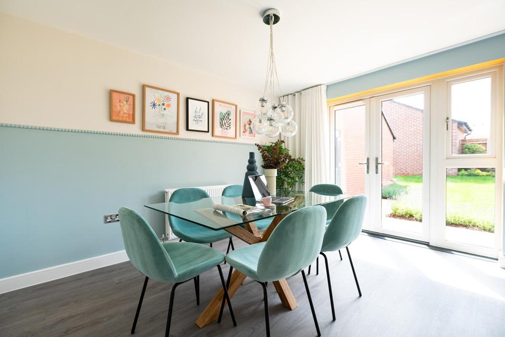 The dining area has double doors out to the...