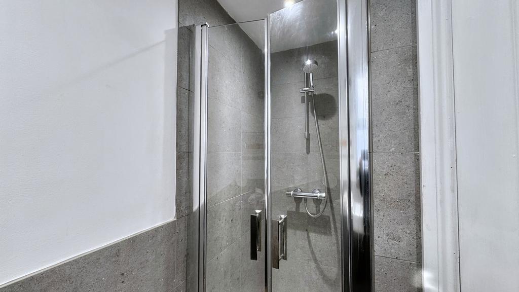 A modern and stylish bathroom featuring a sleek...