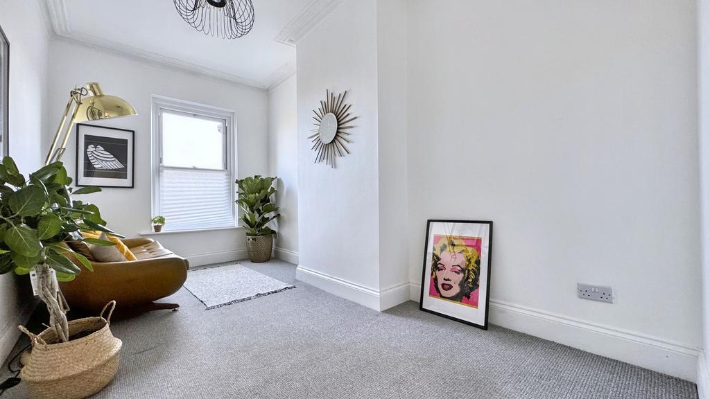 A bright and stylish hallway featuring modern d...