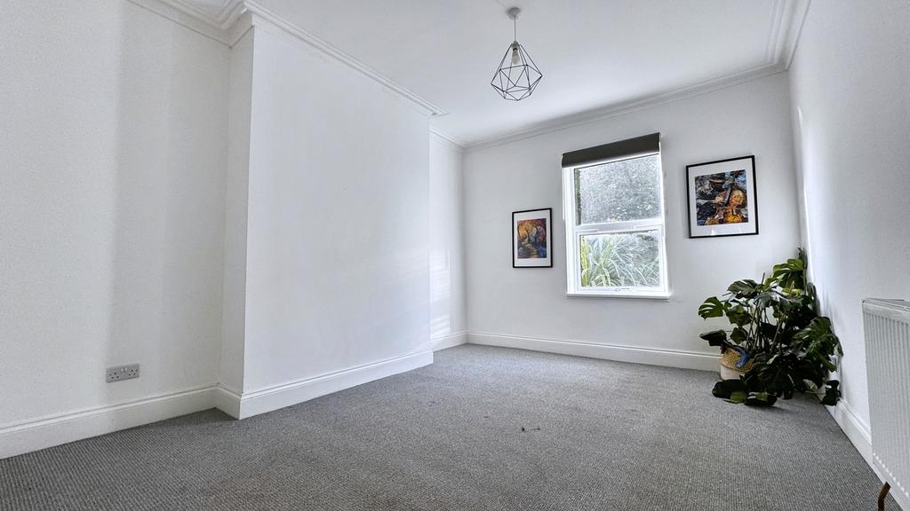 A bright and spacious living room with inviting...