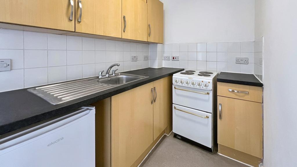 A tidy and functional kitchen featuring modern ...