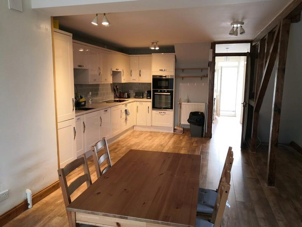 A bright and spacious kitchen featuring modern ...