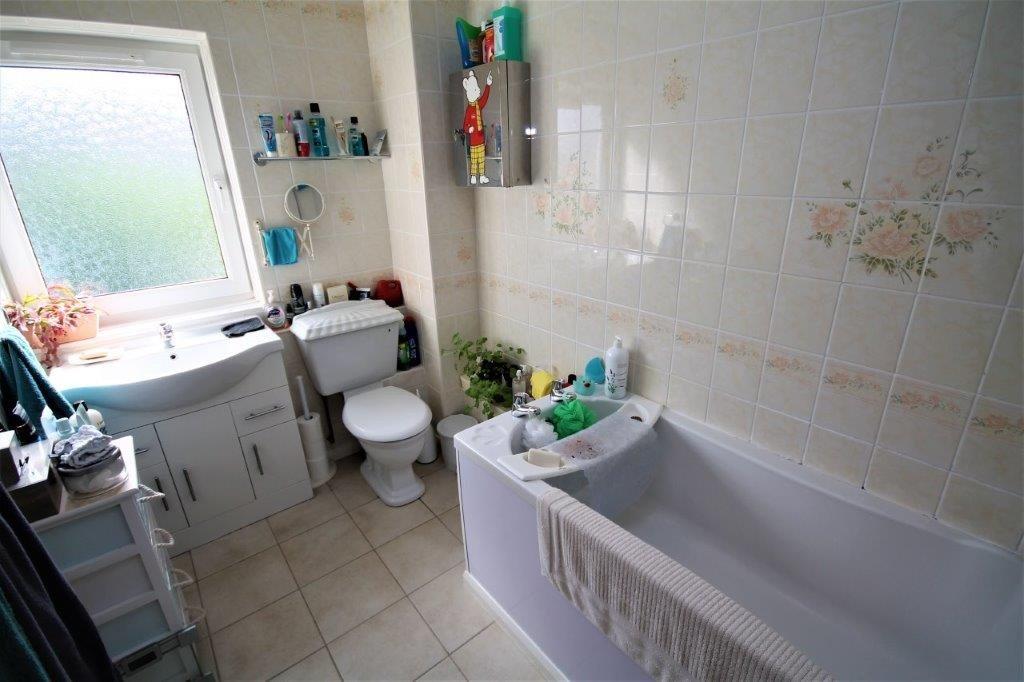 A clean and well-maintained bathroom featuring ...