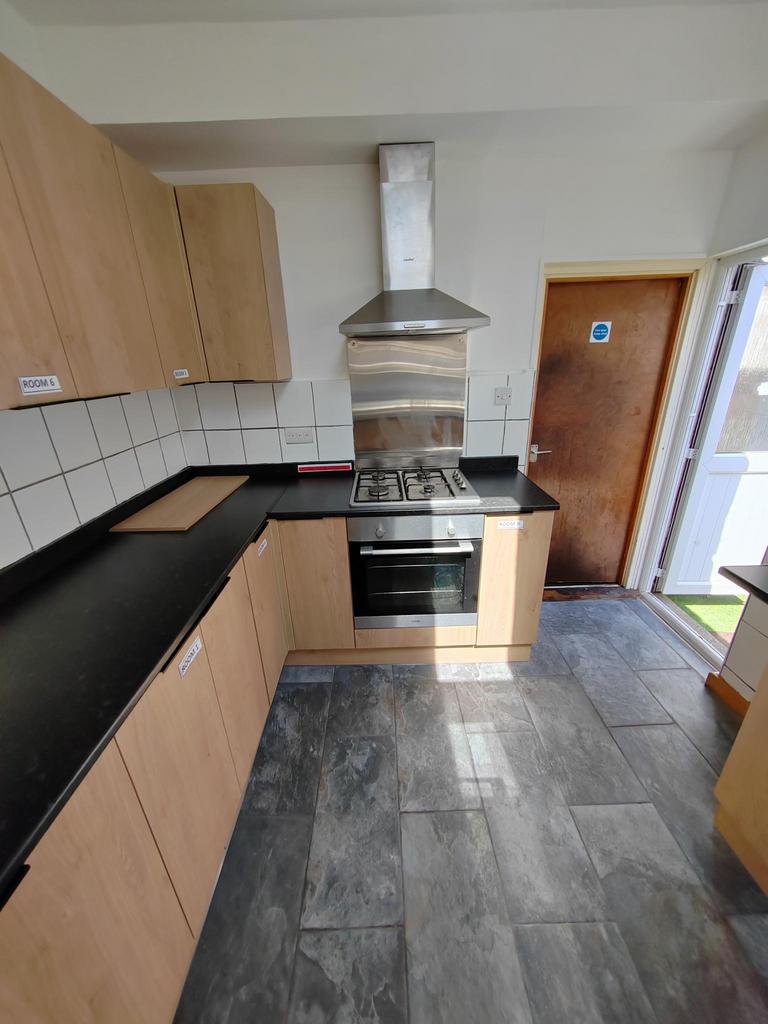 A modern and spacious kitchen with ample storag...