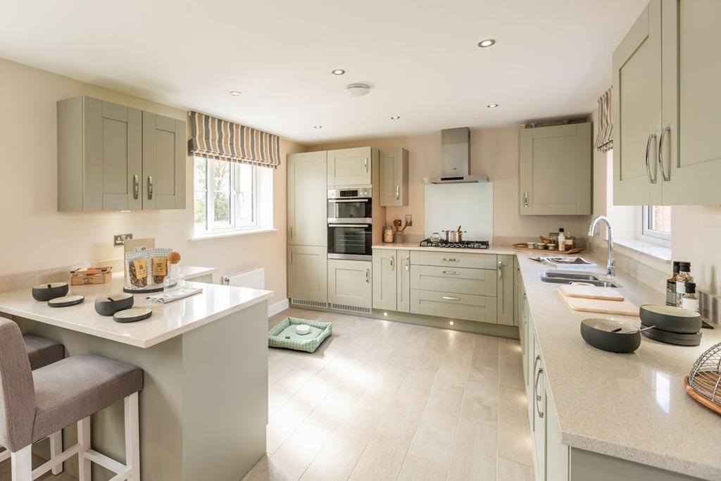 Beautifully designed kitchen with breakfast bar