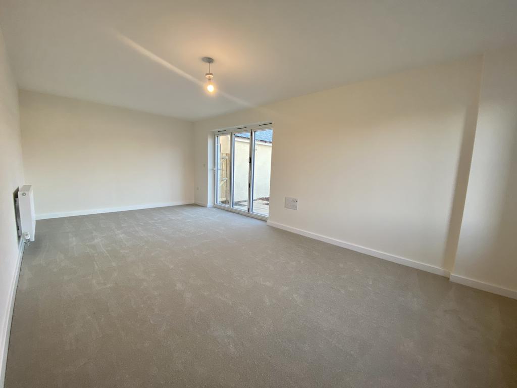 Spacious Sitting Room with Bi-Folds on to...