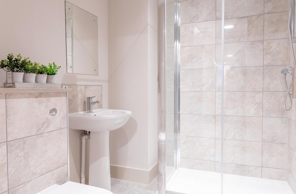 A modern and pristine bathroom featuring a styl...