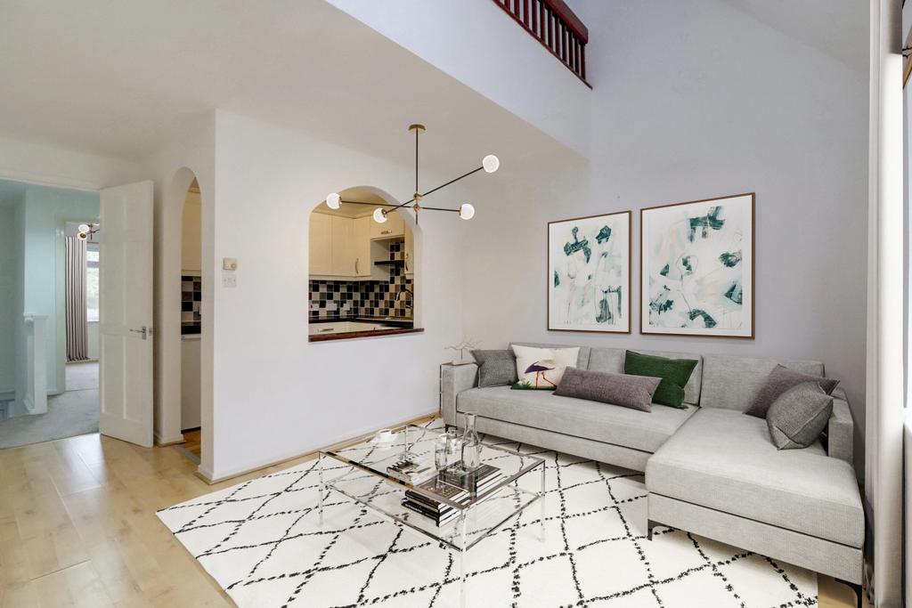 Living and dining room with a view of the kitchen