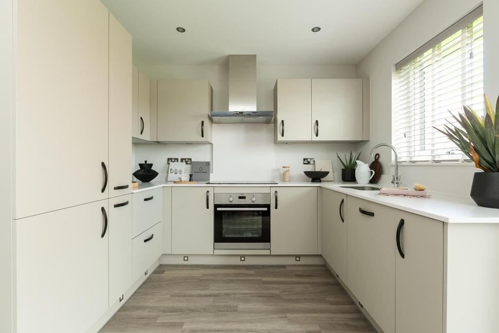 The modern kitchen has ample storage and...